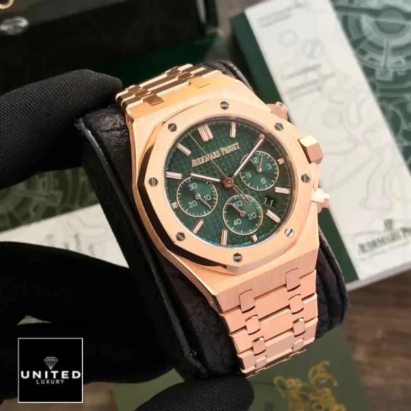 ap rose gold green dial on the man hand