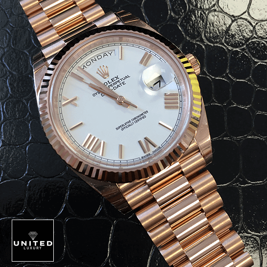 Rolex Day-Date 228235 Rose Gold Inspired on the black leather table