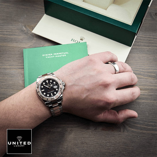 Rolex Yatch Master 116621 Rose Gold Black Dial Inspired warranty card next to