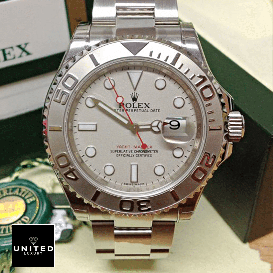 Rolex Yacht Master Platinum Dial Steel Inspired next to warranty card
